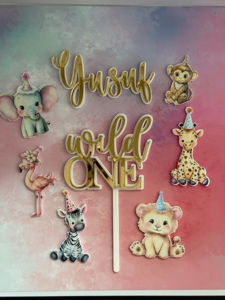 Gold Yusuf and Wild One toppers with printed safari animals