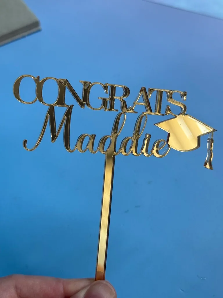 Gold mirror Congrats Maddie graduation topper with a mortarboard