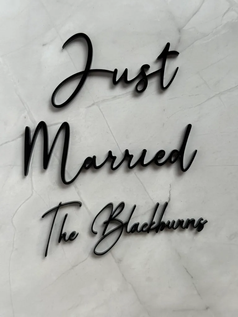 Gloss black Just Married and The Blackburns script plaques